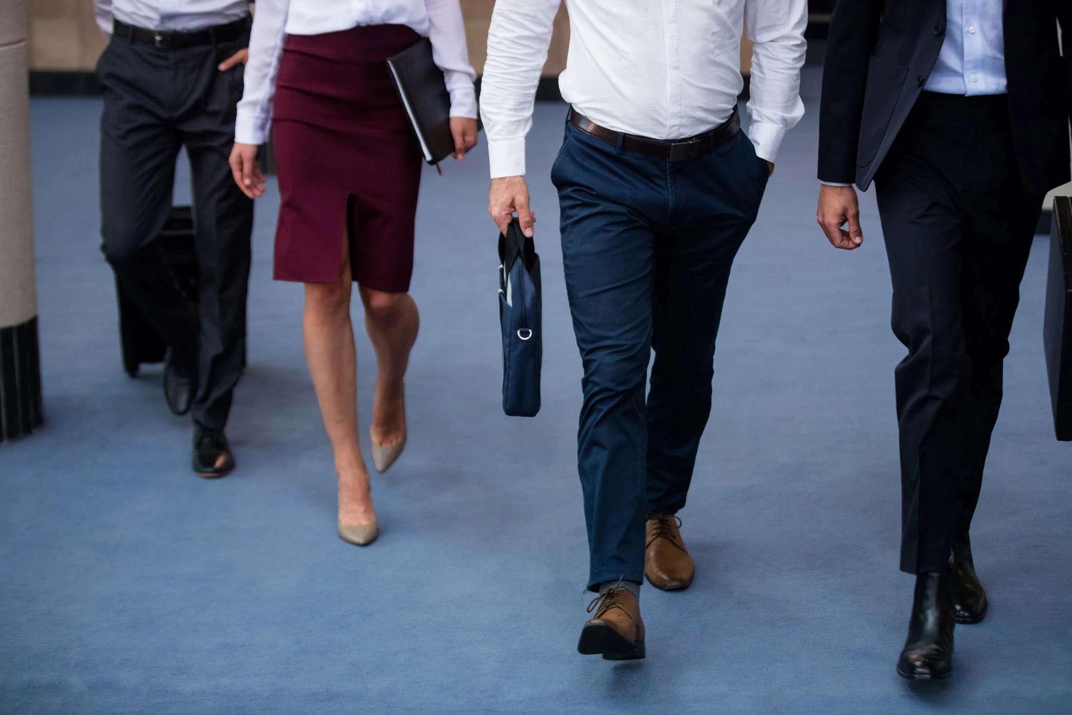 business-executives-walking-in-a-conference-center-2025-04-03-03-17-55-utc2.webp